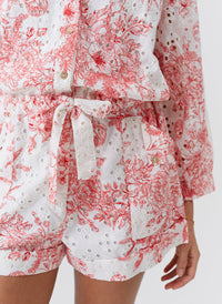 suri-coastal-red-playsuit_model_2026_closeup 